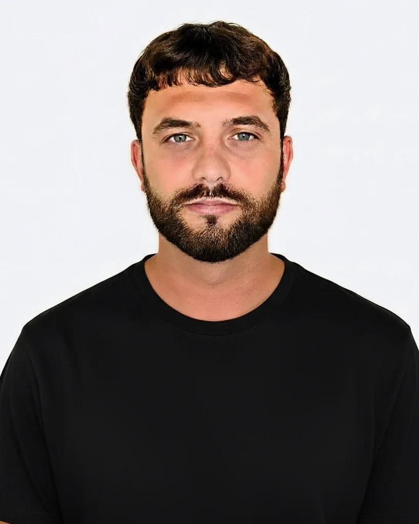 Rikki, founder of Nomad Community, in a black t-shirt